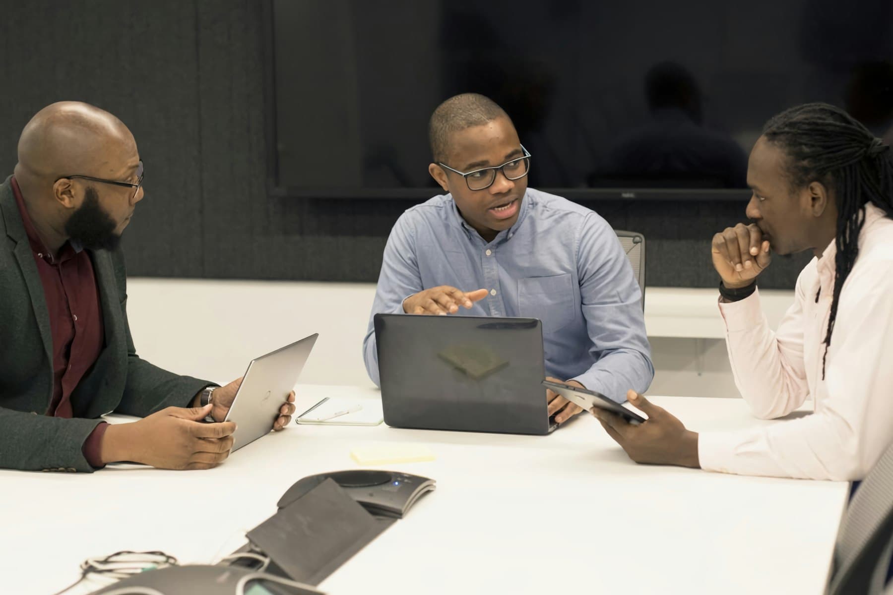 Imaansoft engineers working through a problem together